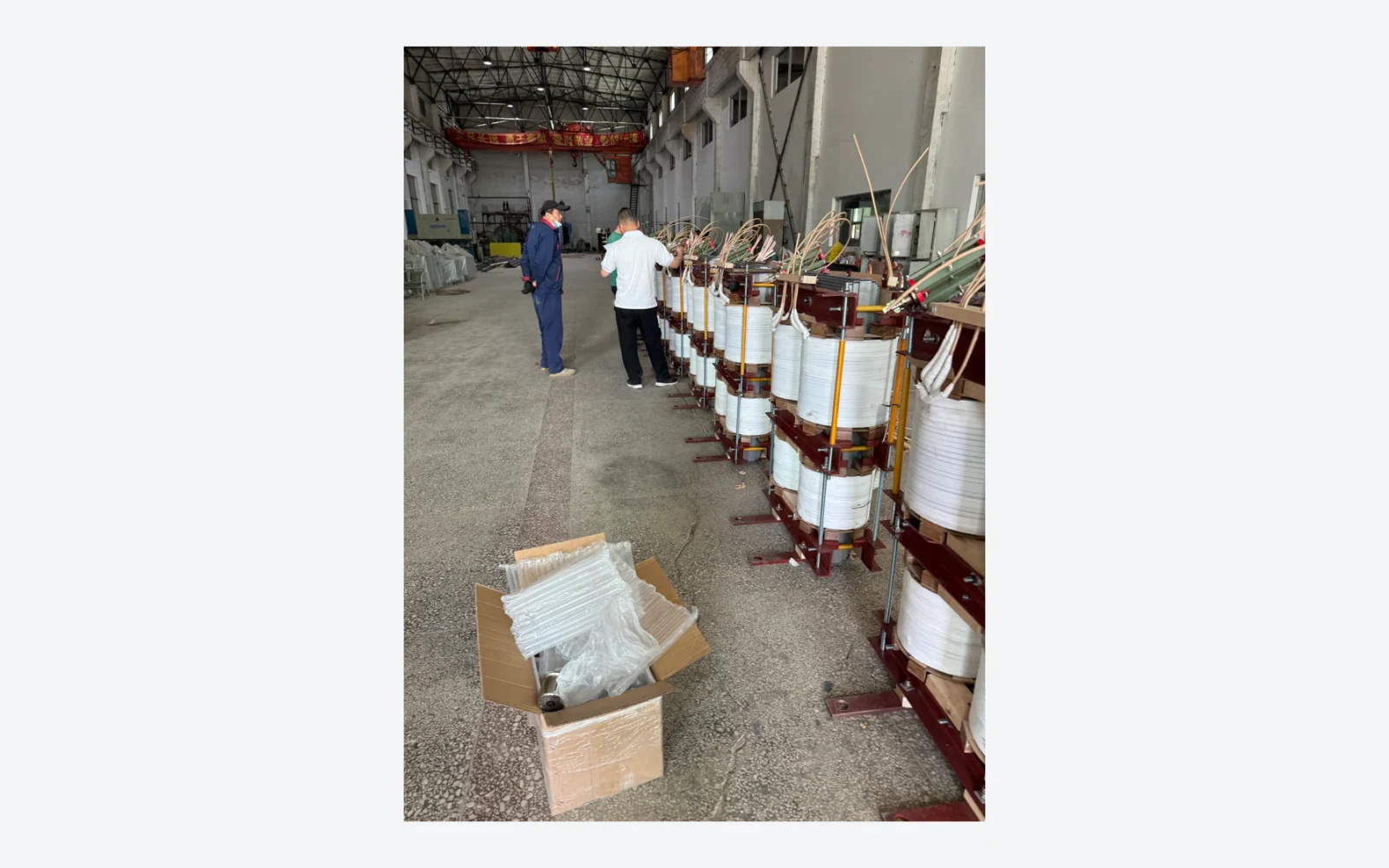 Authentic factory photograph of transformer active-part assemblies during production