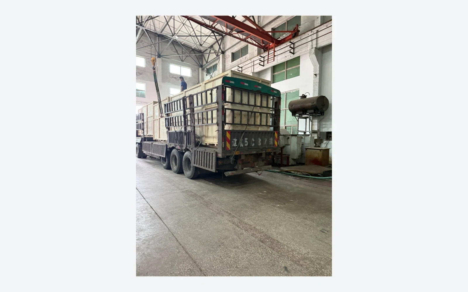 Authentic factory photograph of a crated transformer shipment leaving the workshop