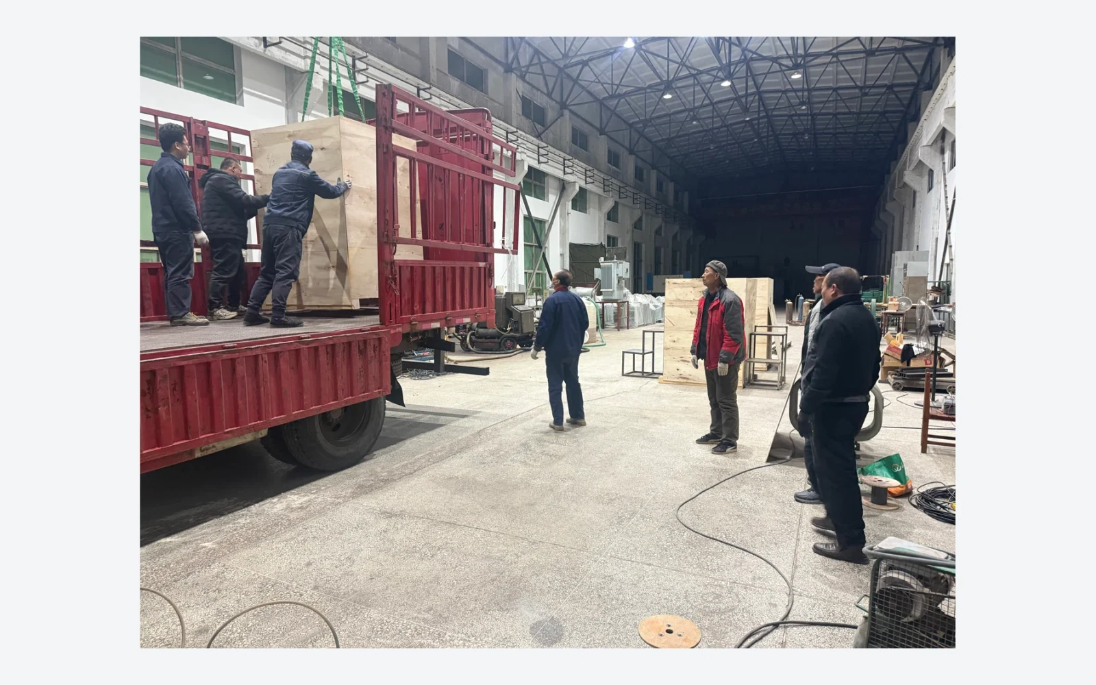 Authentic factory photograph of a crated product being loaded for delivery